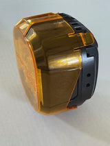 Amber lens on a light module on a white background