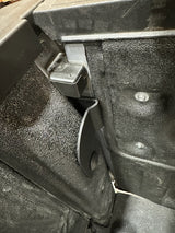 Side view of textured black bracket installed on bed post with tailgate up