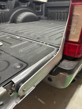 Aluminum colored bracket installed on a truck