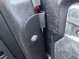 side view of textured black bracket installed on bed post with tailgate up