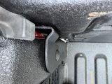 top view of textured black bracket installed on bed post with tailgate up