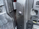 side view of textured black bracket installed on bed post with tailgate up, picture provided by a customer