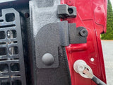 side view of textured black bracket installed on bed post with tailgate down, red truck, picture provided by customer