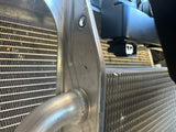 Side view of black bracket installed, radiator in background