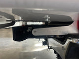 Aluminum bracket installed on truck with bottom of camper visible
