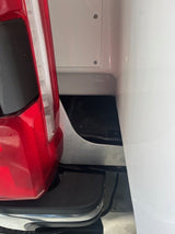 close up of Aluminum bracket installed on truck with side of camper visible