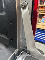 Aluminum bracket installed on truck with work bench in background