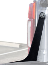 Different angle of a black bracket with taillight in the background